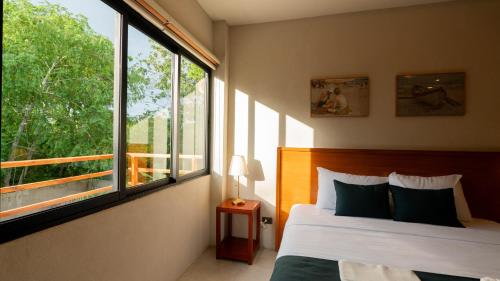 Giường trong phòng chung tại Dono Pool Villa & Spa