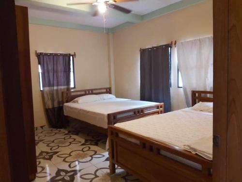 Giường trong phòng chung tại Ahuachapán Getaway