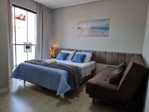 En eller flere senge i et værelse på Casa Duplex a 1km do Beto Carrero e 200m da praia