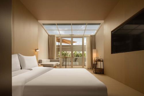 Ένα ή περισσότερα κρεβάτια σε δωμάτιο στο NEST HOUSE