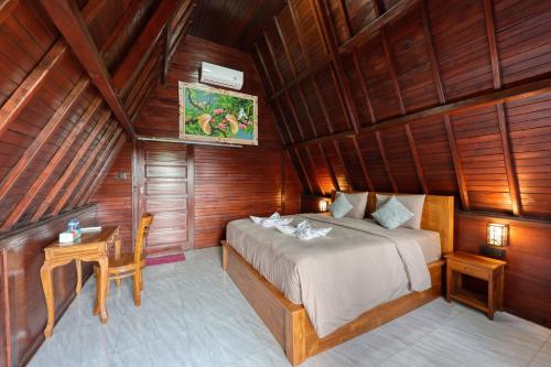 En eller flere senge i et værelse på Jun Cottage