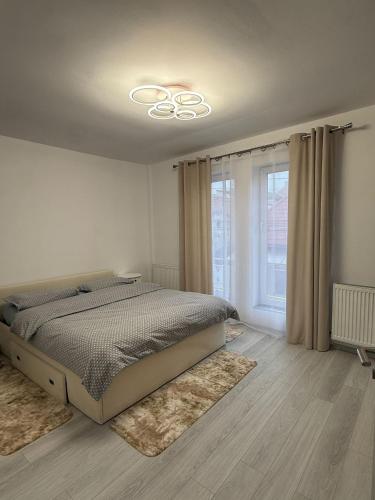 Ένα ή περισσότερα κρεβάτια σε δωμάτιο στο Apartament CASA MIRIAM