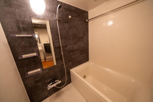 Koupelna v ubytování ザ サウンドクレスト五条駅前25 The Sound Crest Gojo-Ekimae