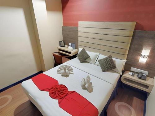 Postel nebo postele na pokoji v ubytování Paragon Nagoya Hotel Batam