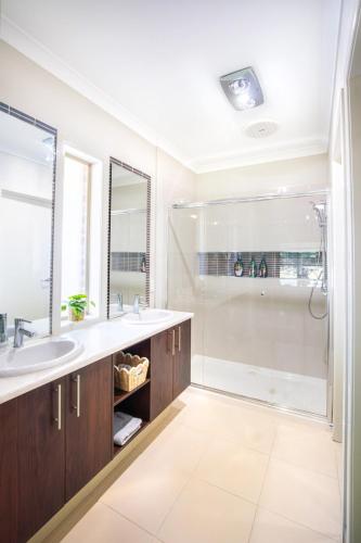 a bathroom with a shower and a sink at Popular Grand Villa Shepparton in Shepparton