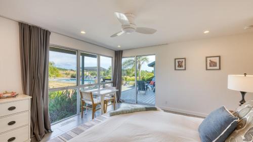 a bedroom with a bed and a view of a balcony at Coplan Vineyards by AvantStay 10-Acre Estate w Pool Spa Bocce Designer Interiors in Sonoma