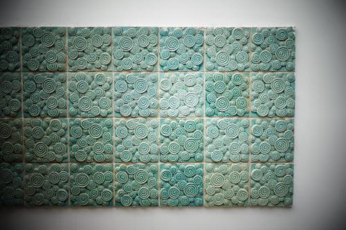 a wall with green and white tiles on it at Hotel Cote Cour Deductive Beijing - Quadrangle close to Tiananmen Square & Forbidden City & Nanluoguxiang, Walk to Wangfujing, English speaking, Free WiFi, Free Laundry, Free Wonton & Noodles with Tour ticket service, Free selfies with ancient costume in Beijing