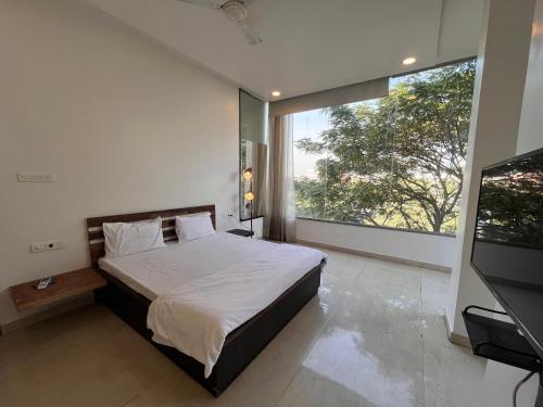 Postel nebo postele na pokoji v ubytování Hotel Golden Leaf