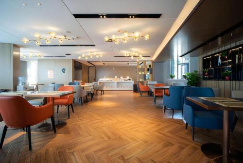Un restaurante u otro lugar para comer en Echarm Hotel Changsha Wuyi Square Xiangya Affiliated 1st Provincial Maternity and Child
