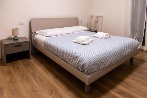 Ένα ή περισσότερα κρεβάτια σε δωμάτιο στο Ca' Martha - A due passi dal centro con parcheggio privato