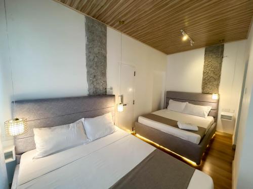 Postel nebo postele na pokoji v ubytování La Costa Hotel