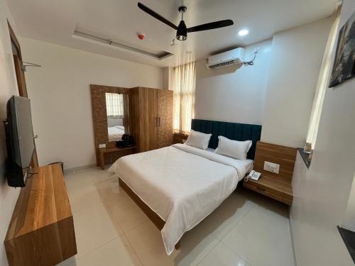 Ένα ή περισσότερα κρεβάτια σε δωμάτιο στο Hotel Lotus Suites