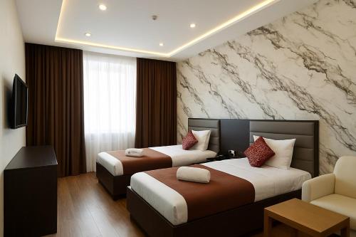 Rúm í herbergi á Vatan Hotel