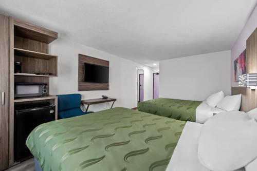 Postel nebo postele na pokoji v ubytování Quality Inn - Denton