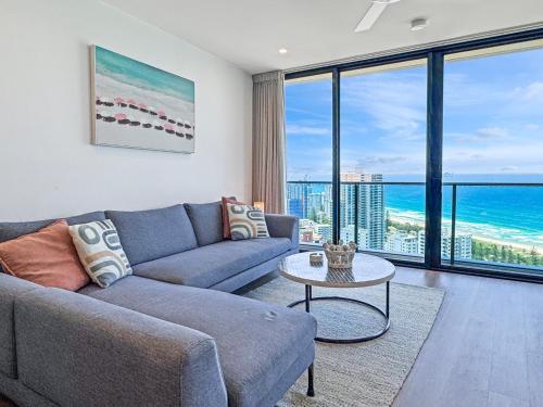a living room with a couch and a table at Level 30 Oracle Tower 2 Stunning views and free parking - GC Getaways in Gold Coast