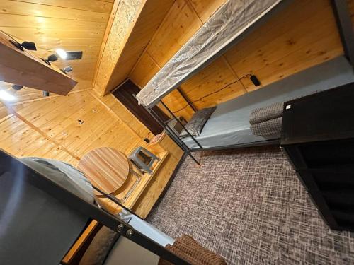 an overhead view of a room with a bed and wooden floors at Tehran mets armenia in Yerevan