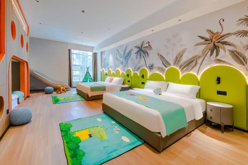 Postel nebo postele na pokoji v ubytování Miomi Family Hotel