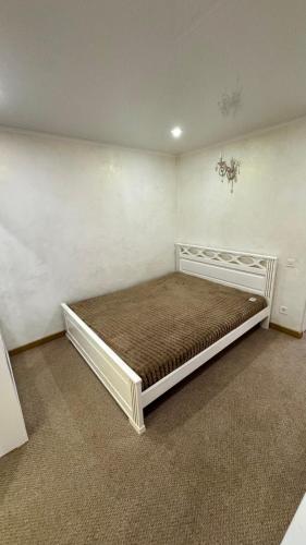 a bedroom with a large bed in a room at Чумацький табір in Dryglov