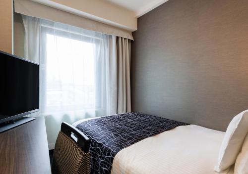 TV a/nebo společenská místnost v ubytování APA Hotel Sakai Ekimae