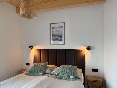 En eller flere senge i et værelse på Villa Panorama