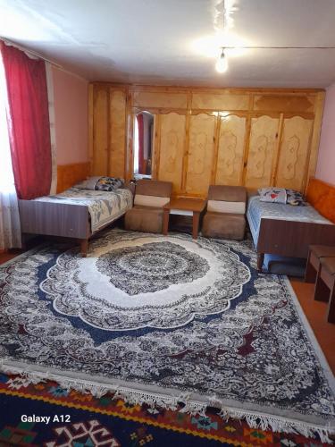 En eller flere senge i et værelse på Guest House