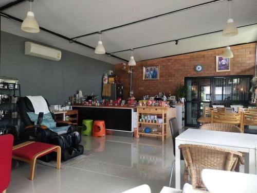 a large room with tables and chairs and a room with at The Lofts Eco Resort in Ban Kut Khamin