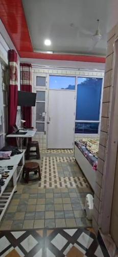 a room with a garage with a large door at Hotel The Ultimate in Solan