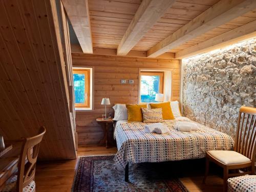 En eller flere senge i et værelse på Chalet Le Dimore Asiago - Ideale per gruppi e Famiglie