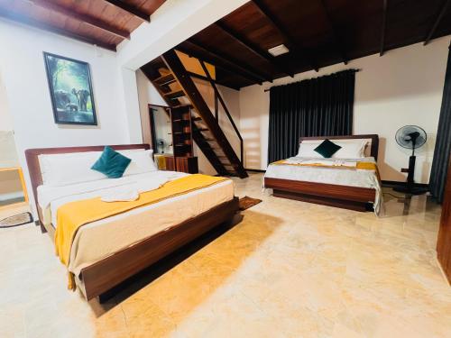 Postel nebo postele na pokoji v ubytování Princess of Dickoya Homestay