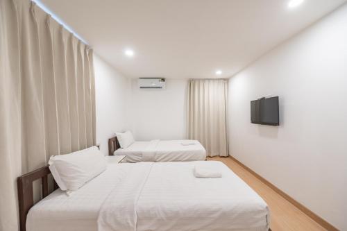 Giường trong phòng chung tại We Inn