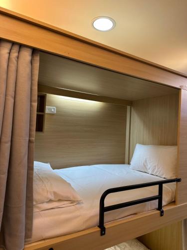 a large bed in the middle of a room at Xingyi Hotel in Chiayi City