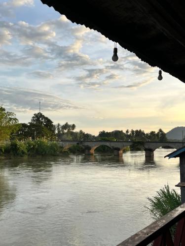 a view of a bridge over a river at Friendship Guesthouse Dondet in Nakasong