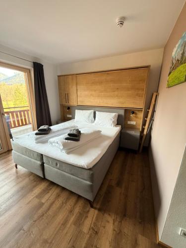 Postel nebo postele na pokoji v ubytování Haus Central Lofer