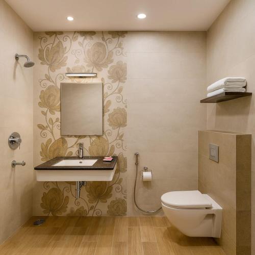 a bathroom with a sink and a toilet at Hotel Goodwill in Kaithal