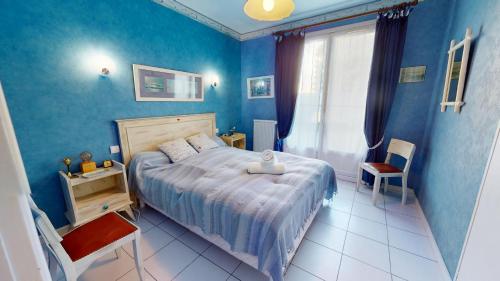 En eller flere senge i et værelse på Le Coin du Large