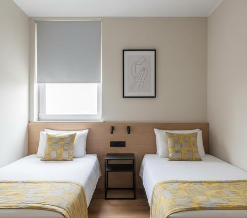 En eller flere senge i et værelse på Bilgin Apart