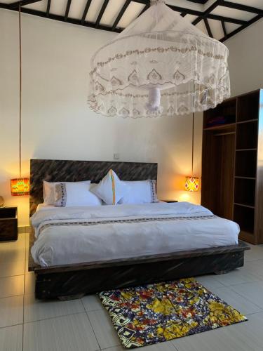 Postel nebo postele na pokoji v ubytování URUGANO VIRUNGA PALACE