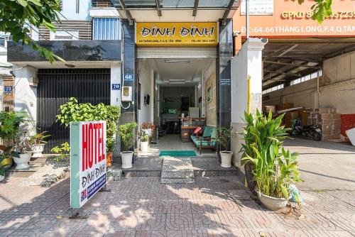 a entrance to a building with a sign in front of it at Đình Đinh Hotel in Ho Chi Minh City