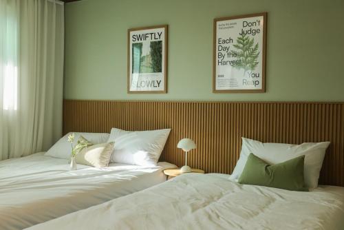 Ένα ή περισσότερα κρεβάτια σε δωμάτιο στο Hongdae Mangwon 3BR Apartment