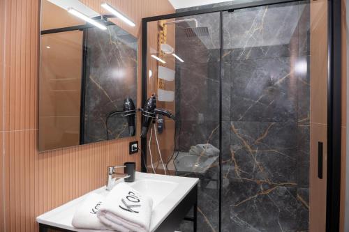 Ванная комната в Kora Rooms