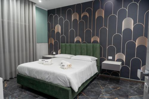 Кровать или кровати в номере Kora Rooms