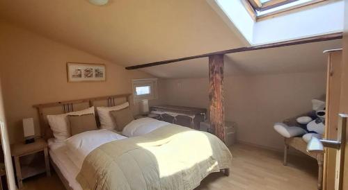 a bedroom with two beds in a attic at Kleine Strandperle in Fehmarn