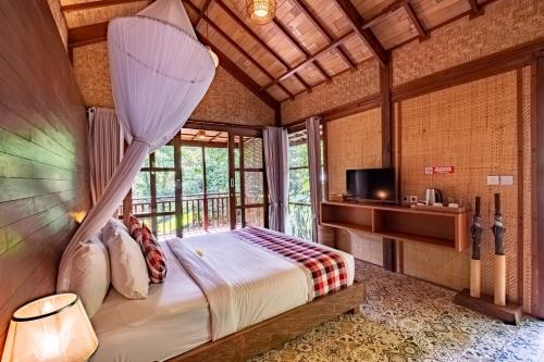 Postel nebo postele na pokoji v ubytování Villa Ubud Sunshine