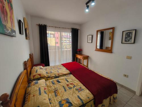 En eller flere senge i et værelse på Jardín Marino