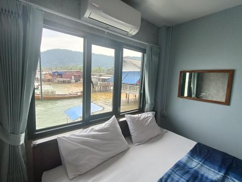 Postel nebo postele na pokoji v ubytování Poohry Seaview