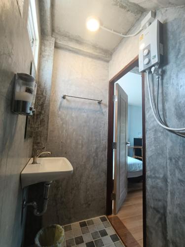 a bathroom with a sink and a shower at Poohry Seaview in Ko Lanta