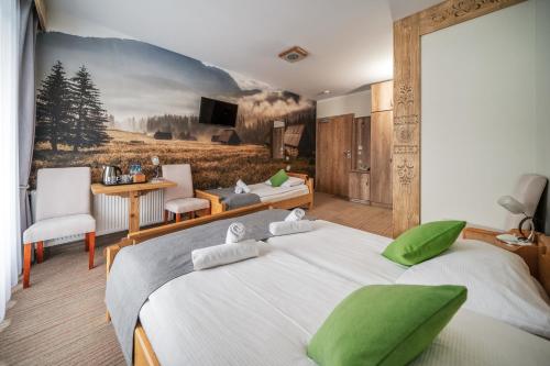 Postel nebo postele na pokoji v ubytování Hotel Eco Tatry Holiday& Spa