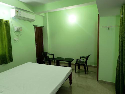 Postel nebo postele na pokoji v ubytování Patliputra Vihar