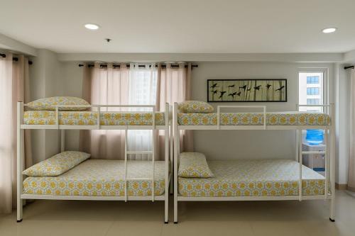 Ένα ή περισσότερα κρεβάτια σε δωμάτιο στο Penthouse A Near IT Park