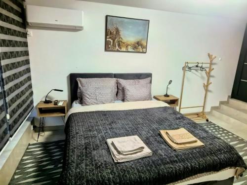 En eller flere senge i et værelse på Apartman Bedem